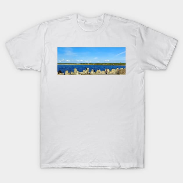 People fishing with a line on an old stone pier on a clear day T-Shirt by EvgeniiV
